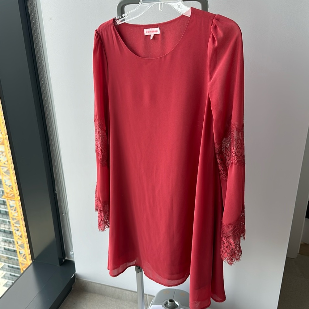 Coral dress with lace sleeve detail. In excellent condition.
